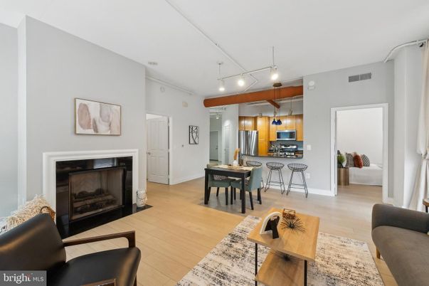 Dining room, Fireplace, Interior, Kitchen, Pendant Lights, Stainless Steel Appliances, Wood Texture Flooring