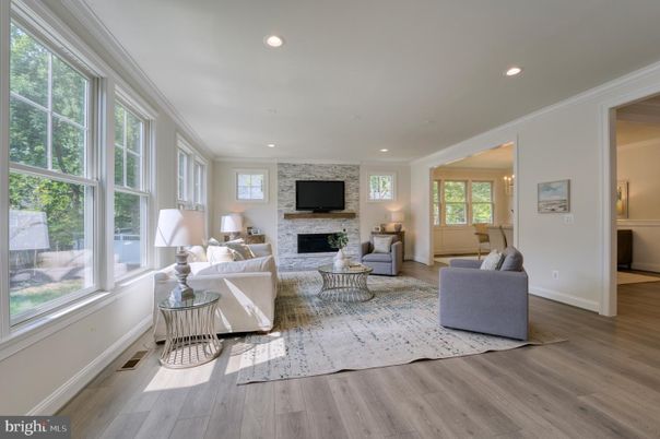 Fireplace, Interior, Living room, Recessed Lighting, Stone Walls, Wood Texture Flooring