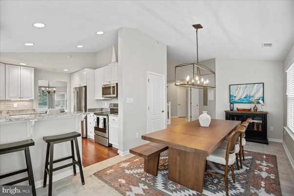 Chandelier, Dining room, Interior, Kitchen, Pendant Lights, Recessed Lighting, Stainless Steel Appliances, Wood Texture Flooring
