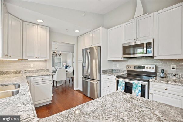 Dining room, Interior, Kitchen, Pendant Lights, Recessed Lighting, Stainless Steel Appliances, Wood Texture Flooring