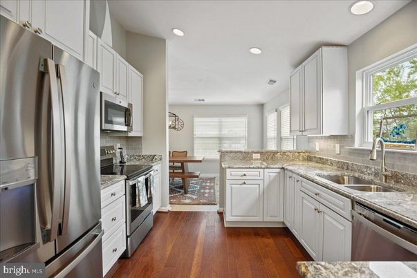 Dining room, Interior, Kitchen, Recessed Lighting, Stainless Steel Appliances, Wood Texture Flooring