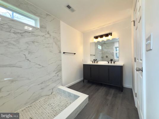 Bathroom, Dual Sink Vanities, Interior, Marble Walls, Wood Texture Flooring