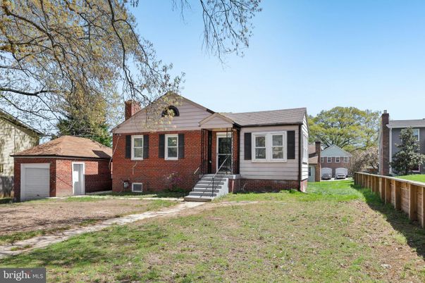 Attached, Backyard, Exterior, Facade, Brick Facade, Cape Cod