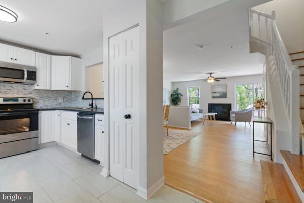 Dining room, Fireplace, Interior, Kitchen, Living room, Stainless Steel Appliances, Wood Texture Flooring