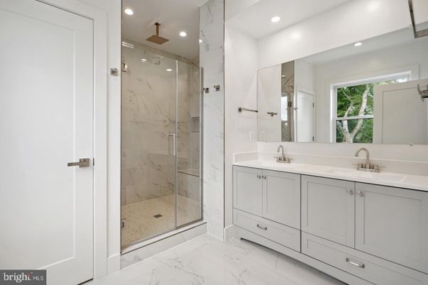 Bathroom, Dual Sink Vanities, Glass Shower, Interior, Marble, Marble Walls, Recessed Lighting
