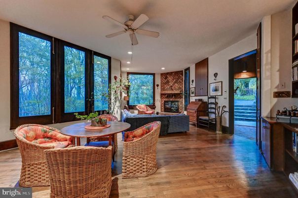 Fireplace, Interior, Living room, Recessed Lighting, Stone Walls, Wood Texture Flooring