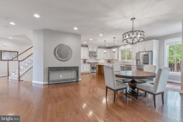 Chandelier, Dining room, Interior, Kitchen, Pendant Lights, Recessed Lighting, Stainless Steel Appliances, Wood Texture Flooring