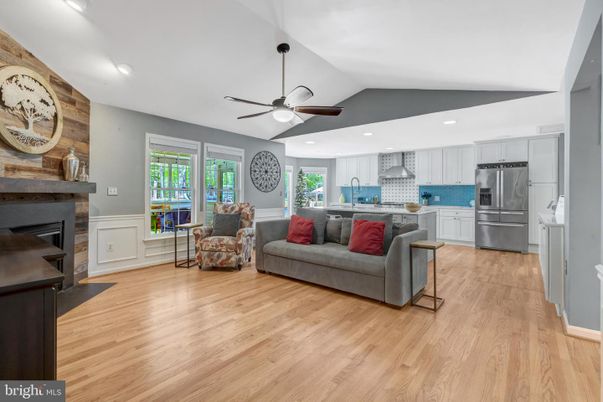 Fireplace, Interior, Kitchen, Living room, Recessed Lighting, Stainless Steel Appliances, Wood Texture Flooring