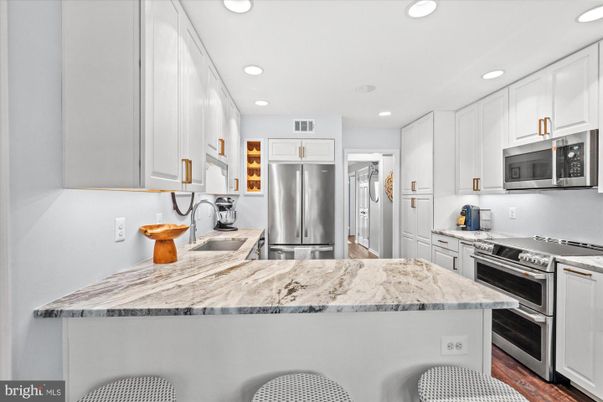Interior, Kitchen, Recessed Lighting, Stainless Steel Appliances, Wood Texture Flooring