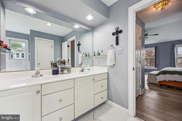 Bathroom, Dual Sink Vanities, Interior, Marble, Recessed Lighting, Wood Texture Flooring