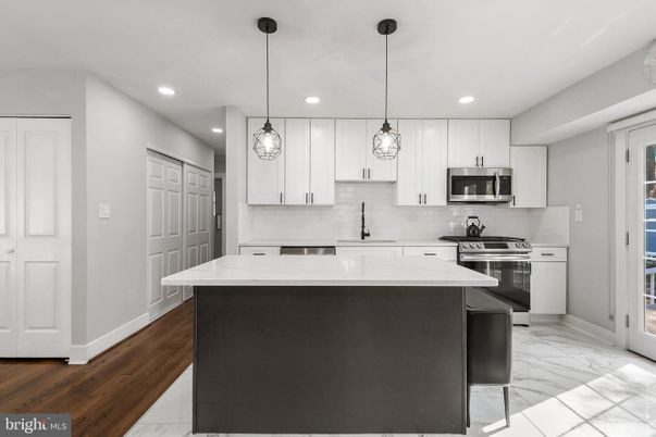 Interior, Kitchen, Marble, Pendant Lights, Recessed Lighting, Stainless Steel Appliances, Wood Texture Flooring