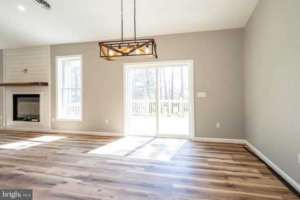 Empty room, Fireplace, Interior, Pendant Lights, Recessed Lighting, Wood Texture Flooring
