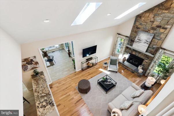 Fireplace, Interior, Living room, Recessed Lighting, Stone Walls, Wood Texture Flooring