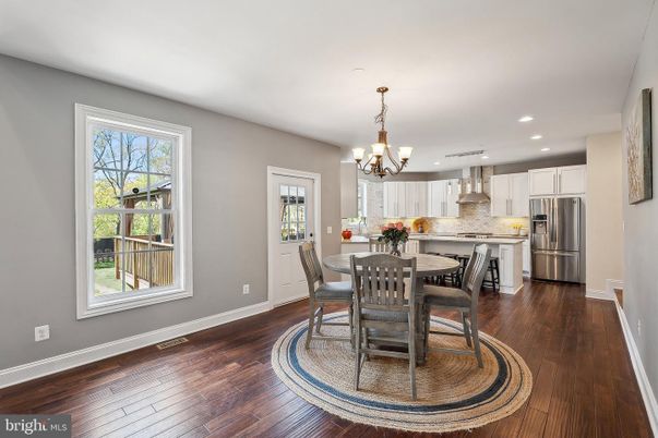 Chandelier, Dining room, Interior, Kitchen, Recessed Lighting, Stainless Steel Appliances, Wood Texture Flooring