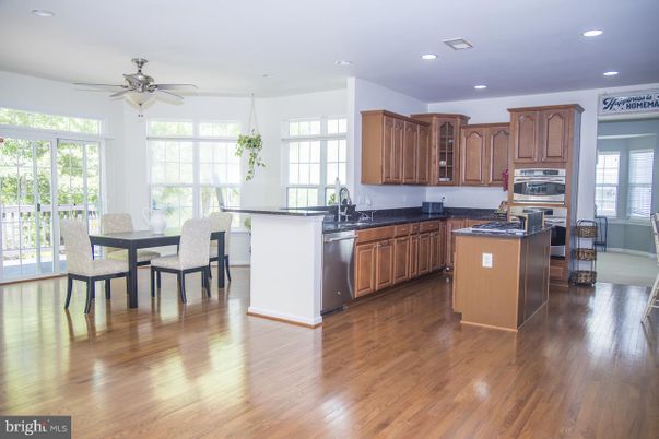 Dining room, Interior, Kitchen, Recessed Lighting, Stainless Steel Appliances, Wood Texture Flooring