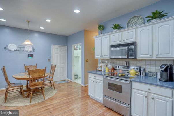 Dining room, Interior, Kitchen, Pendant Lights, Recessed Lighting, Stainless Steel Appliances, Wood Texture Flooring