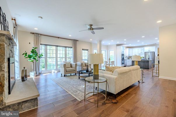 Fireplace, Interior, Kitchen, Living room, Recessed Lighting, Stainless Steel Appliances, Stone Walls, Wood Texture Flooring