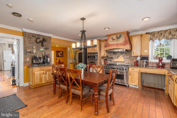 Dining room, Interior, Kitchen, Pendant Lights, Recessed Lighting, Stainless Steel Appliances, Stone Walls, Wood Texture Flooring