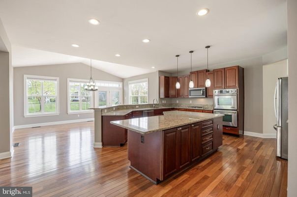 Chandelier, Interior, Kitchen, Pendant Lights, Recessed Lighting, Stainless Steel Appliances, Wood Texture Flooring