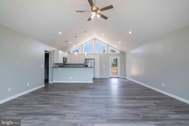 Empty room, Interior, Kitchen, Pendant Lights, Recessed Lighting, Stainless Steel Appliances, Wood Texture Flooring