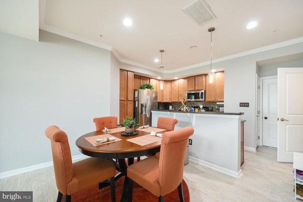 Dining room, Interior, Kitchen, Pendant Lights, Recessed Lighting, Stainless Steel Appliances, Wood Texture Flooring