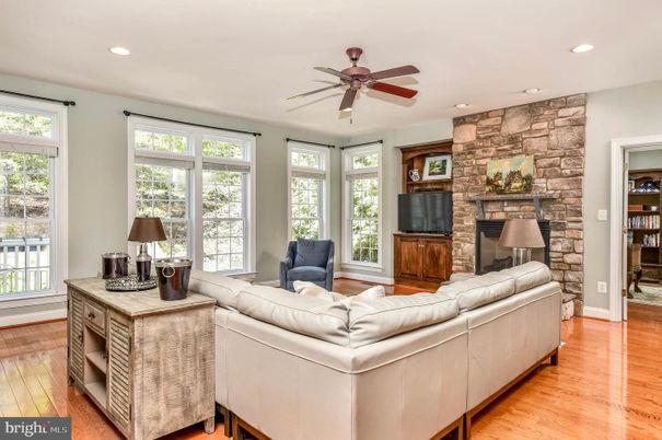 Fireplace, Interior, Living room, Recessed Lighting, Stone Walls, Wood Texture Flooring