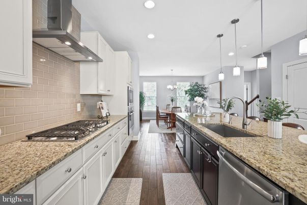 Chandelier, Dining room, Interior, Kitchen, Pendant Lights, Recessed Lighting, Stainless Steel Appliances, Wood Texture Flooring