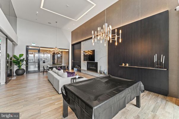 Billiard Table, Fireplace, Game Room, Interior, Living room, Pendant Lights, Recessed Lighting, Wood Texture Flooring