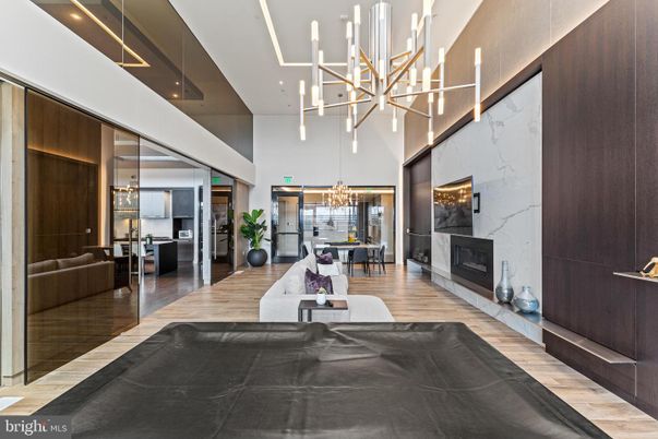 Chandelier, Dining room, Fireplace, Interior, Living room, Marble Walls, Pendant Lights, Wood Texture Flooring
