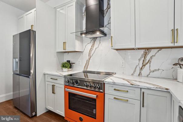 Interior, Kitchen, Marble Walls, Stainless Steel Appliances, Wood Texture Flooring