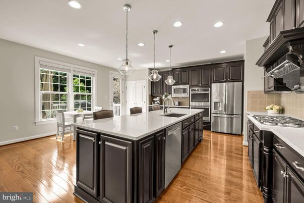 Dining room, Interior, Kitchen, Pendant Lights, Recessed Lighting, Stainless Steel Appliances, Wood Texture Flooring