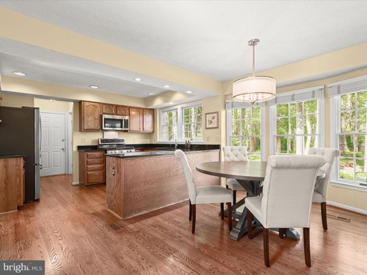 Chandelier, Dining room, Interior, Kitchen, Recessed Lighting, Stainless Steel Appliances, Wood Texture Flooring
