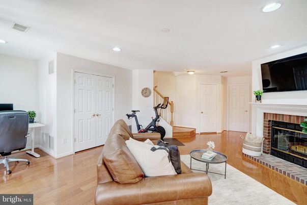 Fireplace, Fitness Equipment, Interior, Living room, Recessed Lighting, Wood Texture Flooring