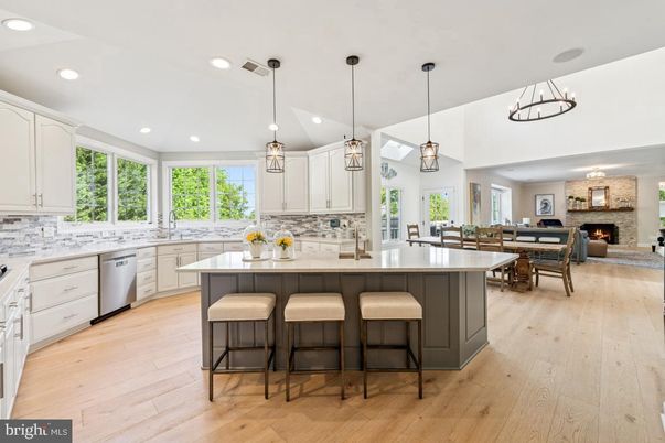 Dining room, Fireplace, Interior, Kitchen, Pendant Lights, Recessed Lighting, Stainless Steel Appliances, Stone Walls, Wood Texture Flooring