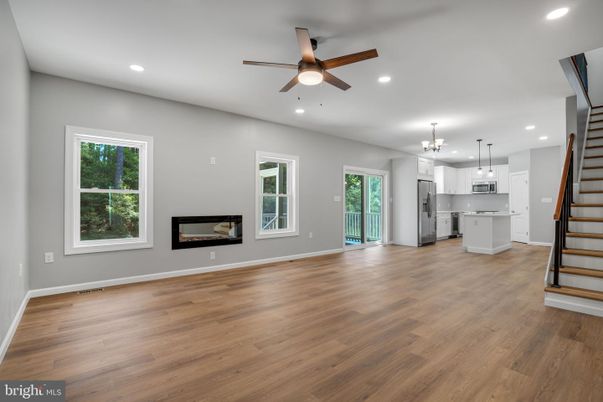 Empty room, Interior, Kitchen, Pendant Lights, Recessed Lighting, Stainless Steel Appliances, Wood Texture Flooring