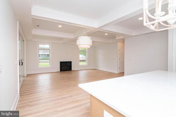 Chandelier, Empty room, Fireplace, Interior, Recessed Lighting, Wood Texture Flooring