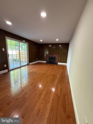 Empty room, Fireplace, Interior, Recessed Lighting, Wood Texture Flooring, Wooden Walls