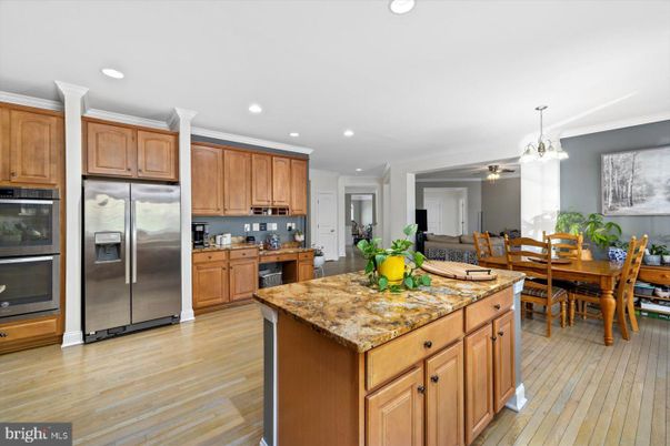 Chandelier, Dining room, Interior, Kitchen, Recessed Lighting, Stainless Steel Appliances, Wood Texture Flooring