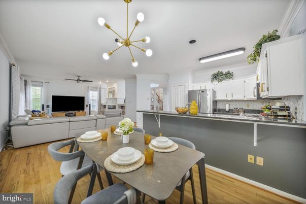 Dining room, Interior, Kitchen, Living room, Pendant Lights, Stainless Steel Appliances, Wood Texture Flooring