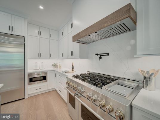 Interior, Kitchen, Marble Walls, Recessed Lighting, Stainless Steel Appliances, Wood Texture Flooring