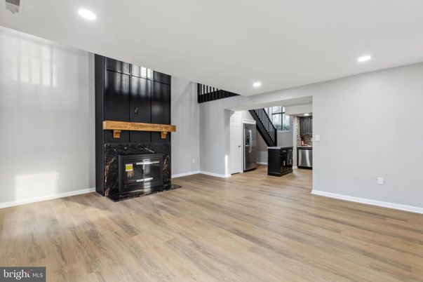 Empty room, Fireplace, Interior, Kitchen, Recessed Lighting, Wood Texture Flooring