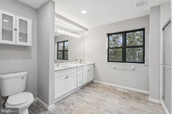 Bathroom, Dual Sink Vanities, Interior, Recessed Lighting, Wood Texture Flooring