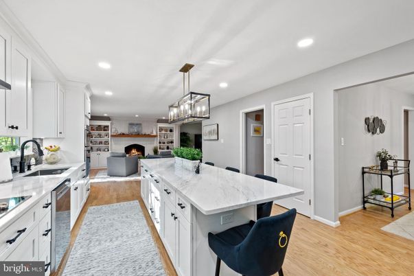 Fireplace, Interior, Kitchen, Living room, Pendant Lights, Recessed Lighting, Stainless Steel Appliances, Wood Texture Flooring