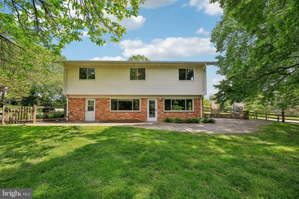 Backyard, Exterior, Facade, Brick Facade, Raised Ranch