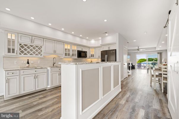 Dining room, Interior, Kitchen, Recessed Lighting, Stainless Steel Appliances, Wood Texture Flooring