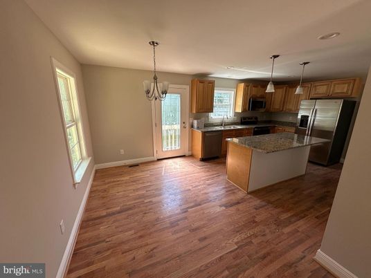 Chandelier, Interior, Kitchen, Pendant Lights, Recessed Lighting, Stainless Steel Appliances, Wood Texture Flooring