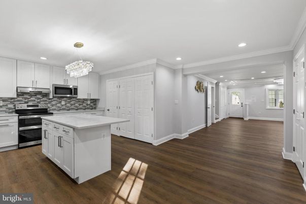 Chandelier, Interior, Kitchen, Recessed Lighting, Stainless Steel Appliances, Wood Texture Flooring