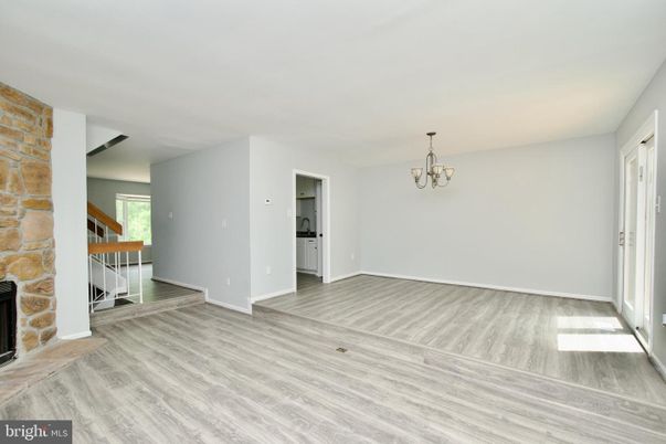 Chandelier, Empty room, Fireplace, Interior, Stone Walls, Wood Texture Flooring