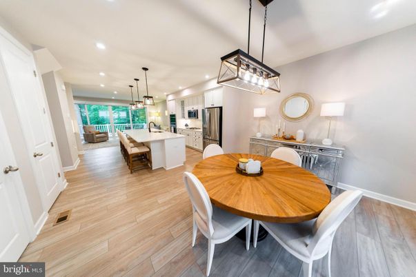 Dining room, Interior, Kitchen, Pendant Lights, Recessed Lighting, Stainless Steel Appliances, Wood Texture Flooring