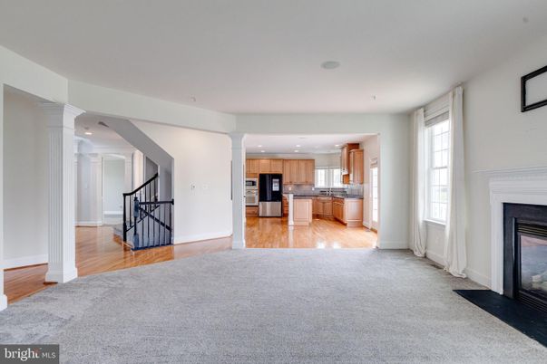 Fireplace, Interior, Kitchen, Recessed Lighting, Stainless Steel Appliances, Wood Texture Flooring